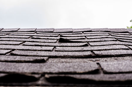 Damaged Asphalt Roof Shingles